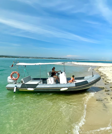 Woman with child driving a speedboat